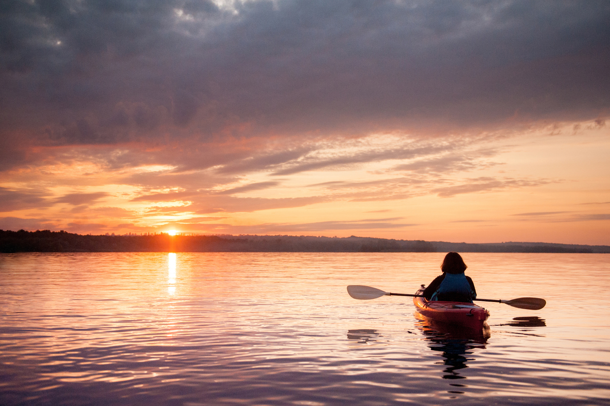 Person with OCD kayaking with the sunset in Colorado