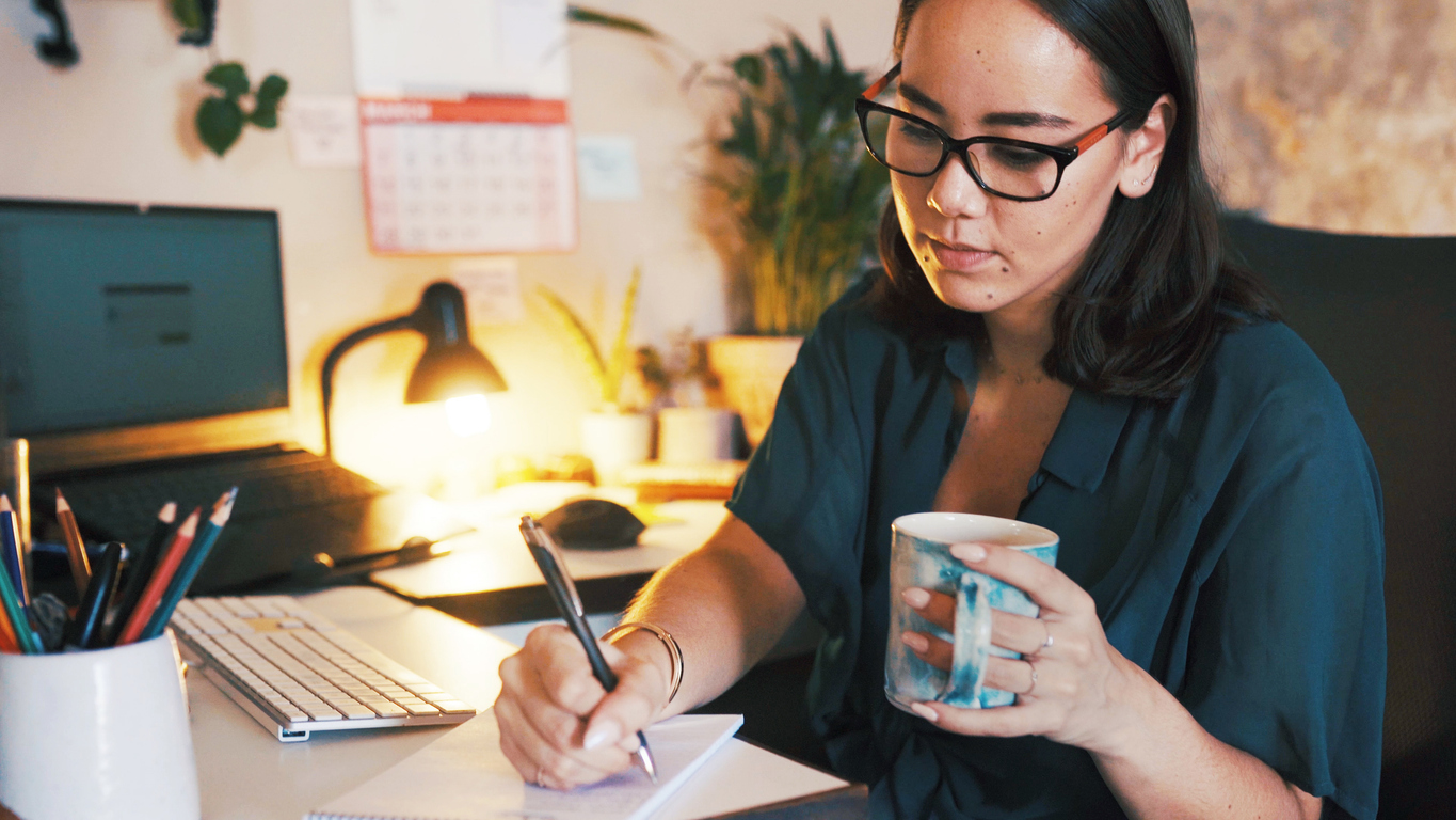 Person making a list and wondering the difference between OCD and perfectionism.