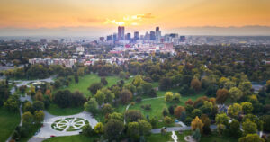 Image of a sunset over Denver cityscape from City Park.