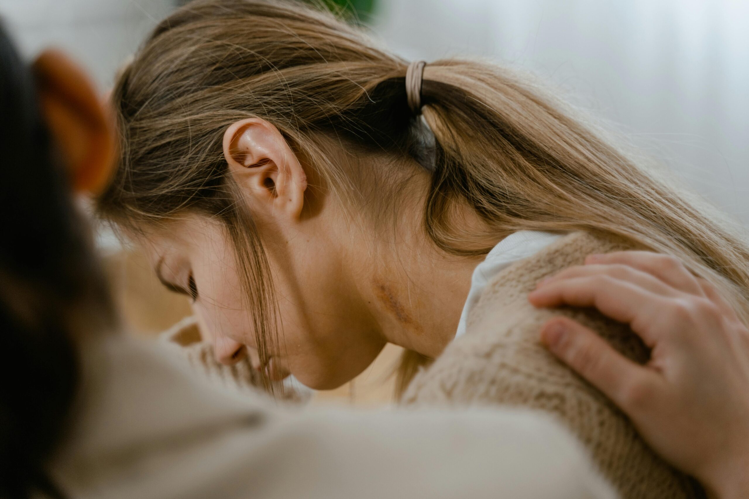 Person supporting a young woman with OCD