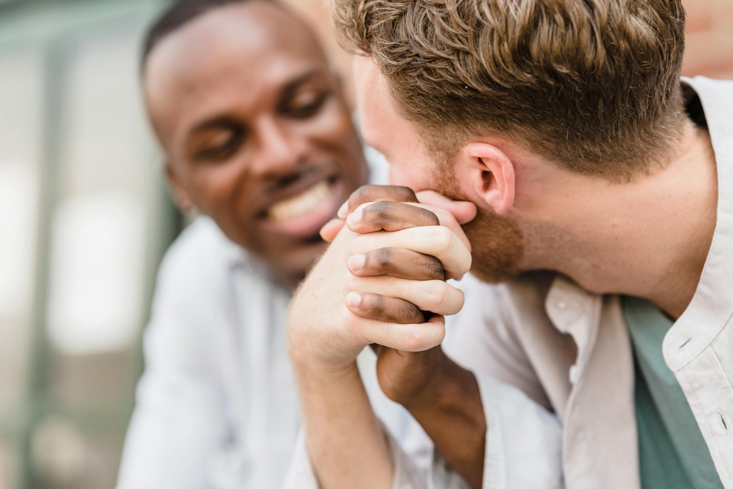 Gay couple supporting each other in seeking mental health support