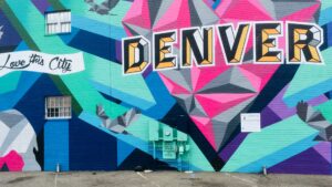 Artwork by Pat Milbery. Mural on a wall in Denver or a heart with the words "Denver" "love this city"